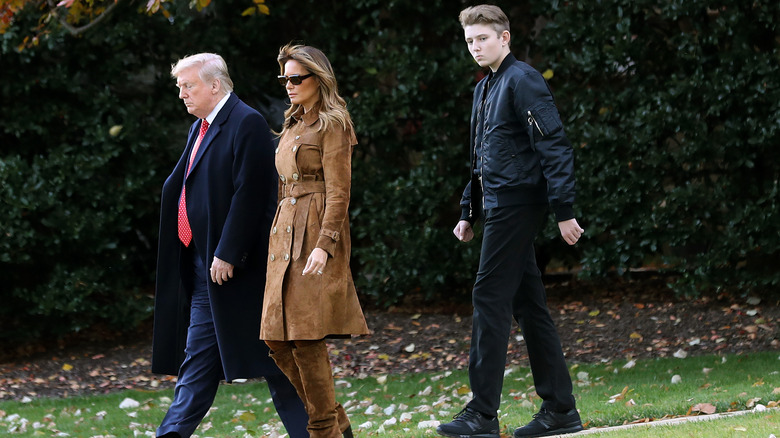 Barron Trump walking with his parents