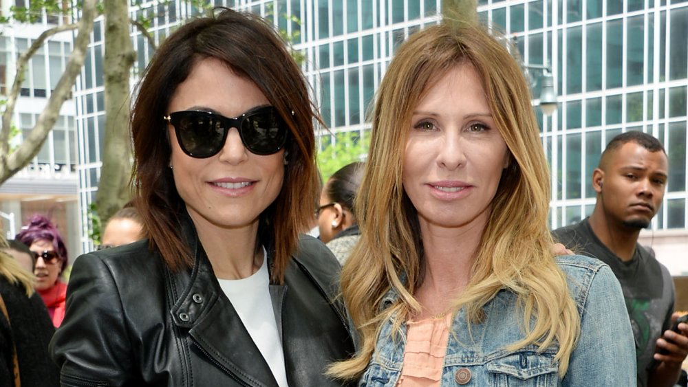 Bethenny Frankel and Carole Radziwill smiling while posing arm in arm