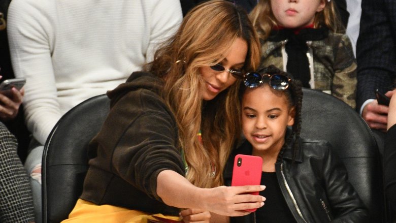 Beyonce sits courtside with Blue Ivy at a basketball game