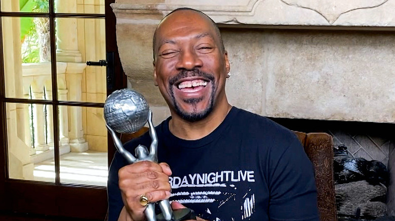 Eddie Murphy at home with his NAACP Award