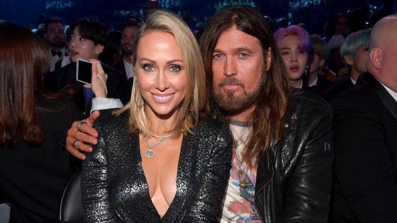 Billy Ray Cyrus and Tish Cyrus smiling