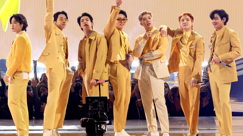 BTS onstage in yellow