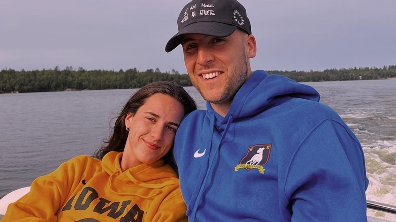 Caitlin Clark and Connor McCaffery talking on a boat