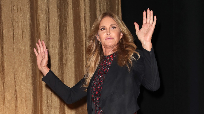 Caitlyn Jenner raises her hands 