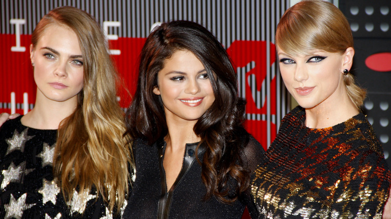 Cara Delevingne poses with Taylor Swift and Selena Gomez in 2015