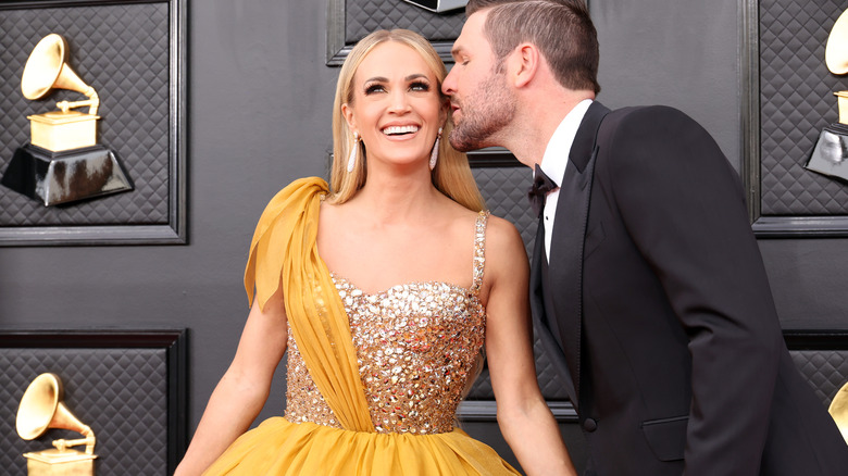 Mike Fisher kissing Carrie Underwood