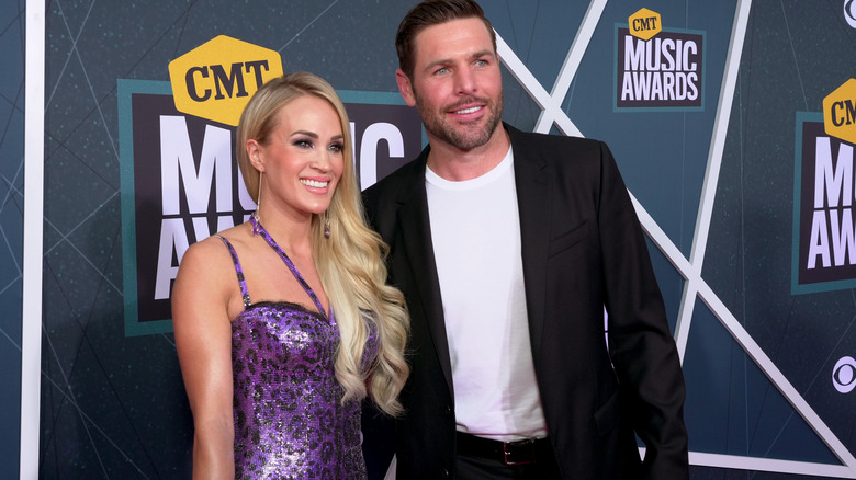 Carrie Underwood and Mike Fisher smiling