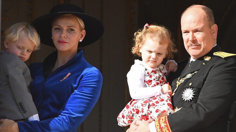 Princess Charlene blue hat, Prince Albert moustache and children