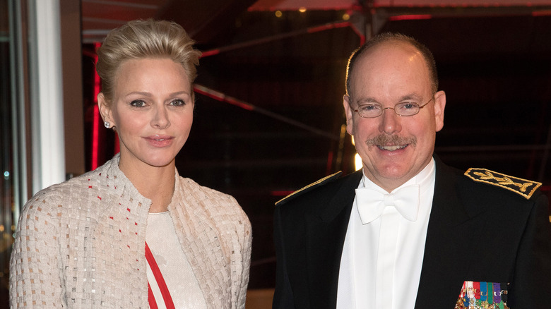 Princess Charlene blonde hair, Prince Albert glasses