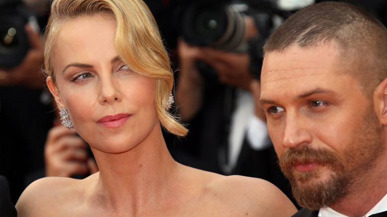Charlize Theron and Tom Hardy at a movie premier 