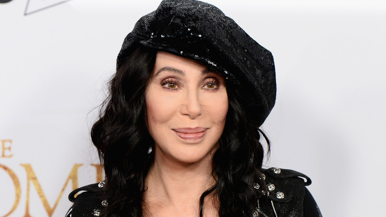 Cher smiles at an event