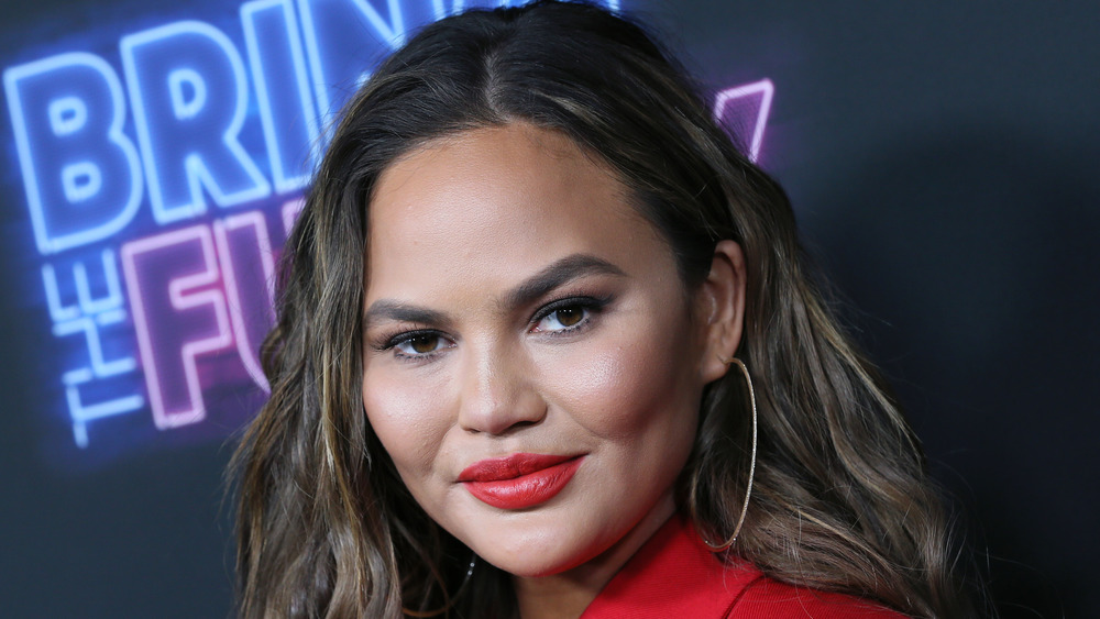 Chrissy Teigen smirking