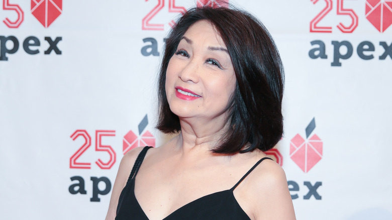 Connie Chung smiles at a red carpet event