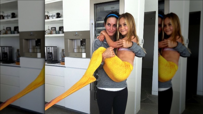 Courteney Cox and Coco dressed as mermaid