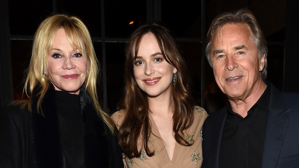 Melanie Griffith, Dakota Johnson, and Don Johnson at an event