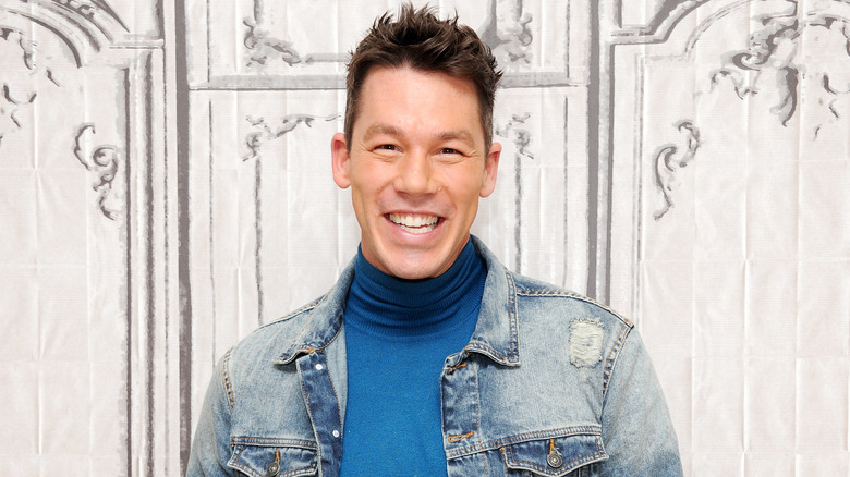 David Bromstad smiling while wearing a blue turtleneck