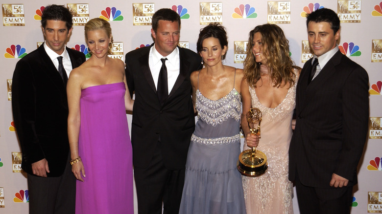 Friends cast smiling Emmys