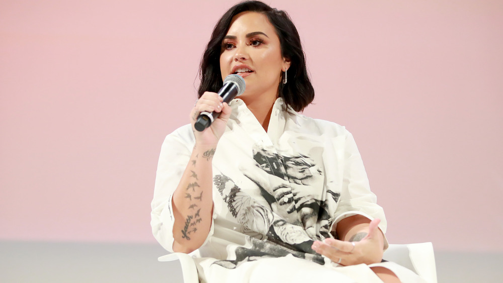 Demi Lovato speaking at the Teen Vogue summit