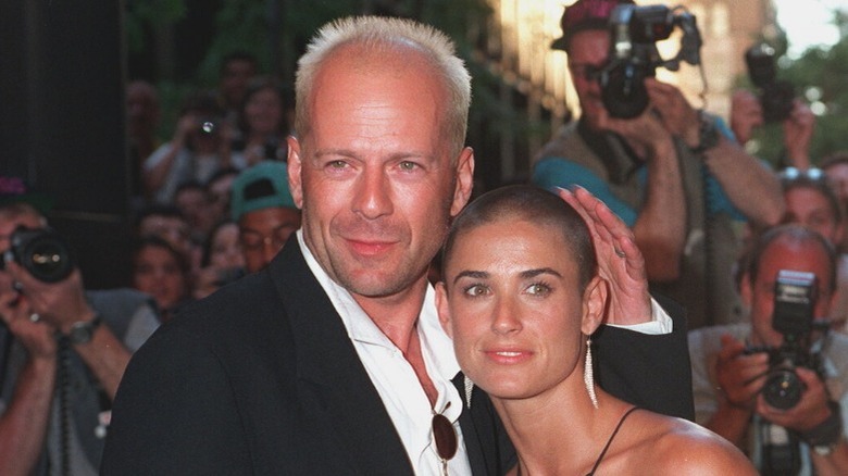 Bruce Willis touching Demi Moore head