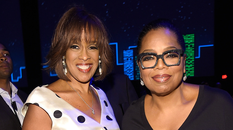 Gayle King and Oprah Winfrey smiling