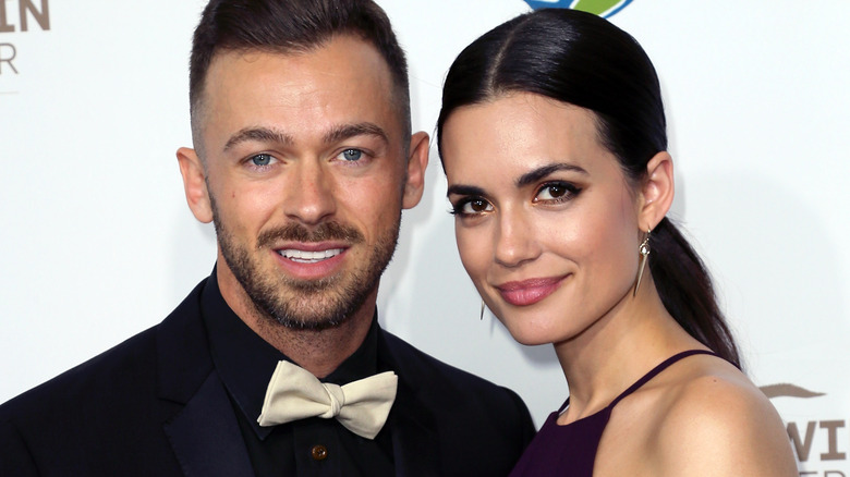 Torrey DeVitto and Artem Chigvintsev smile