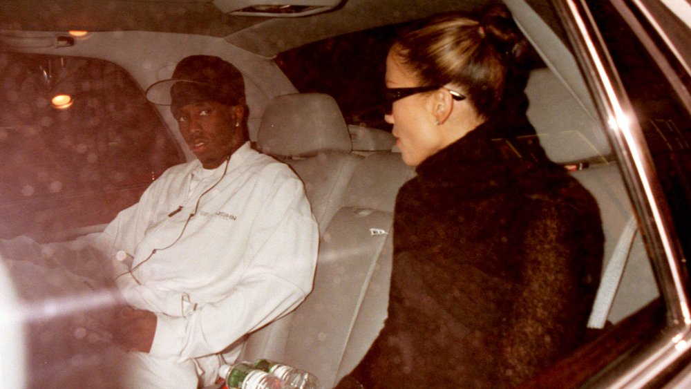 Sean Combs, Jennifer Lopez sitting far apart in a car together, both looking serious