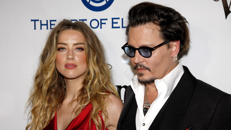 Johnny Depp and Amber Heard posing