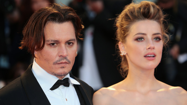 Johnny Depp and Amber Heard posing