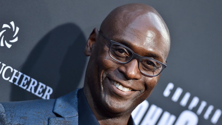 Lance Reddick black glasses smiling