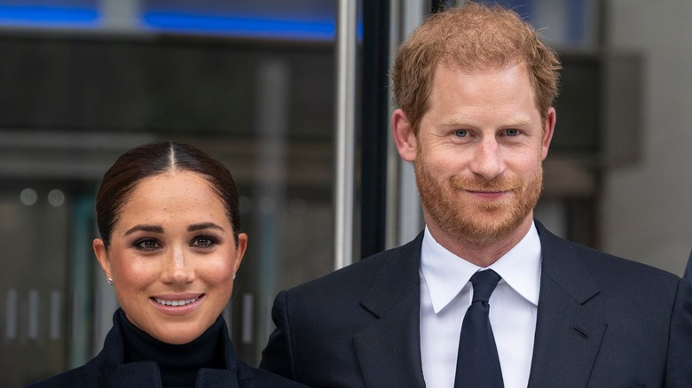 Meghan Markle standing next to Prince Harry