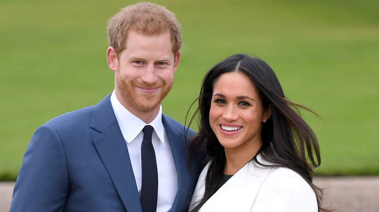 Prince Harry and Meghan Markle smiling