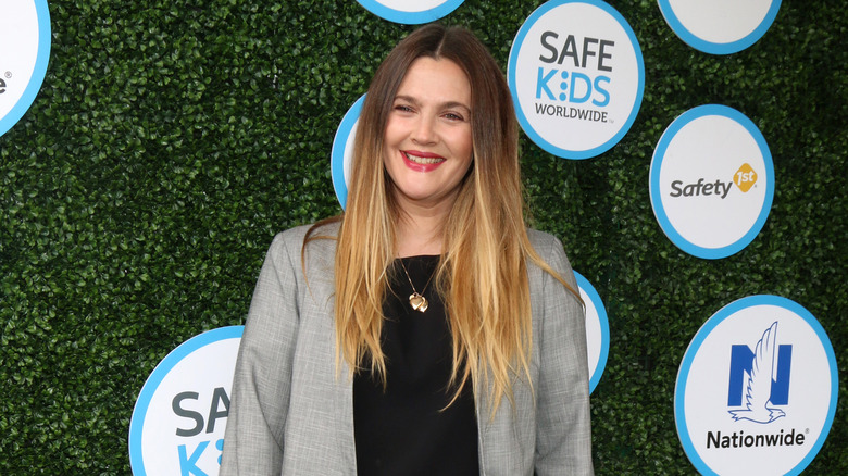 Drew Barrymore poses at an event