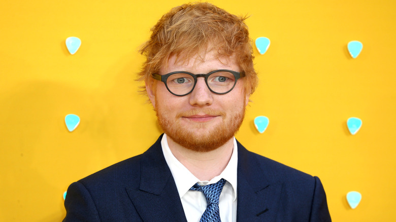 Ed Sheeran wearing glasses on the red carpet