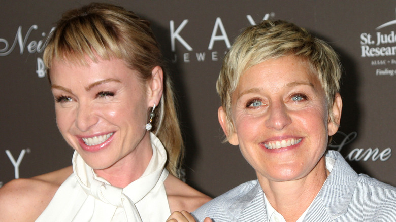 Portia de Rossi and Ellen DeGeneres smiling at an event