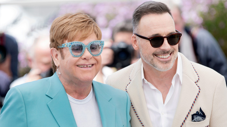 Elton John and David Furnish smiling