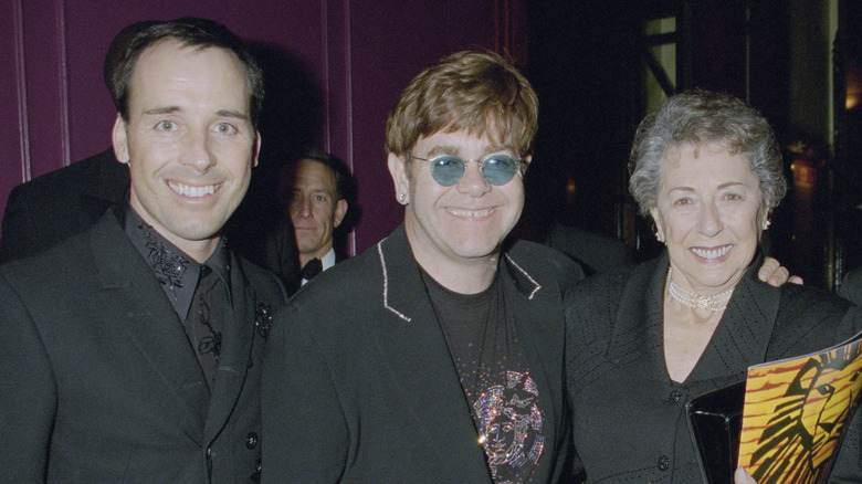 David Furnish, Elton John, and Sheila Farebother posing together