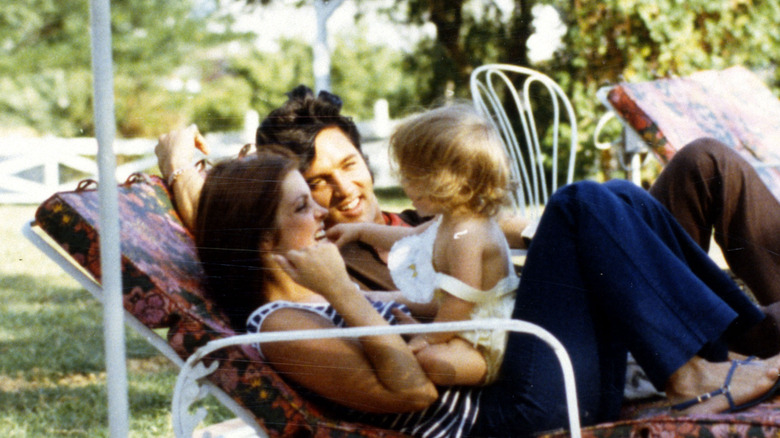 Elvis, Priscilla, and Lisa Marie Presley as a baby