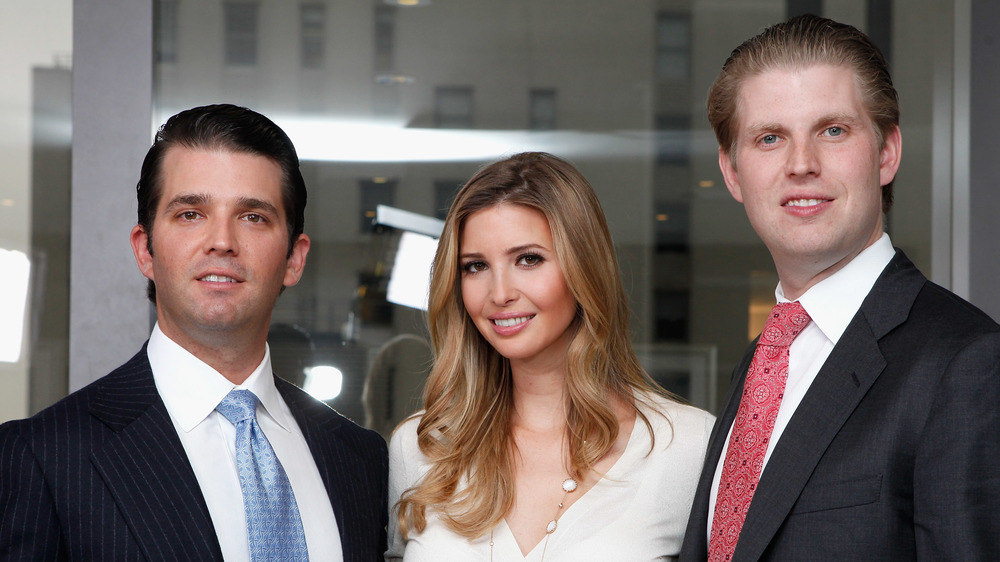 Donald Trump Jr., Ivanka Trump, and Eric Trump smile