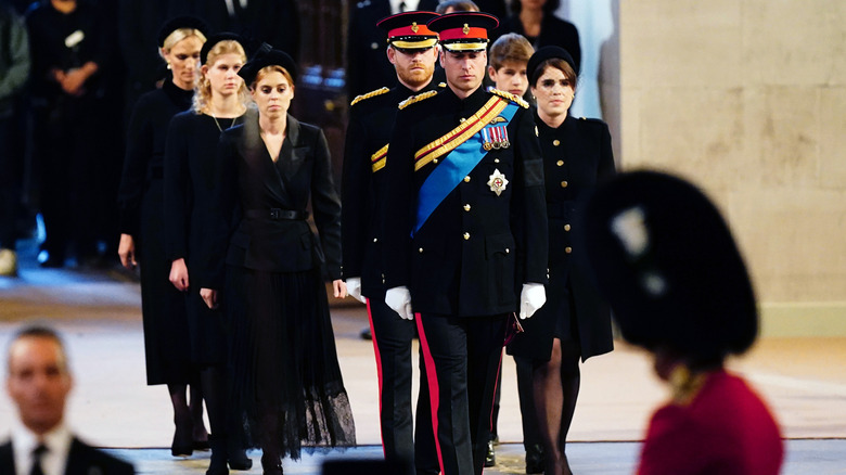 Prince William walking ahead of royal family members