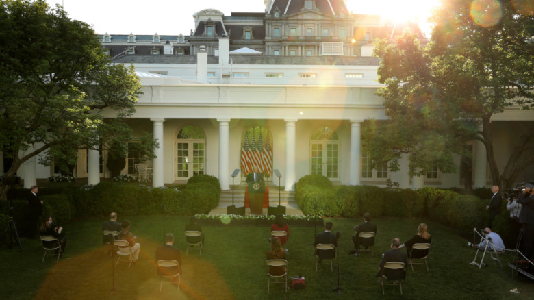 White House Rose Garden with reporters seated in socially distanced chairs