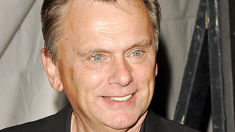 Pat Sajak smiles at an event