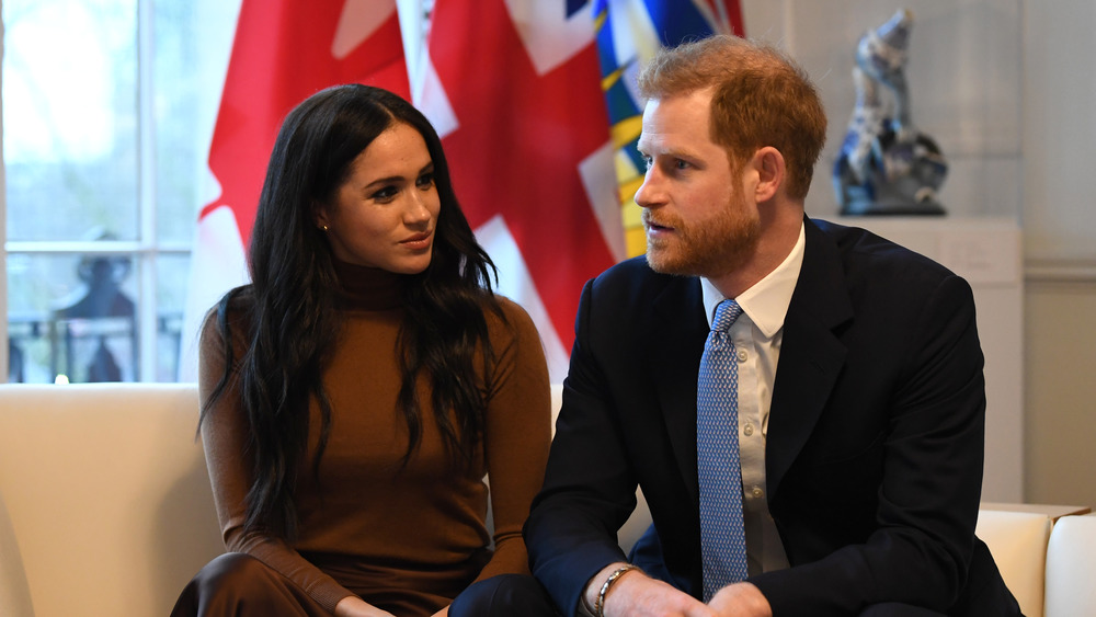 Meghan Markle and Prince Harry speaking 