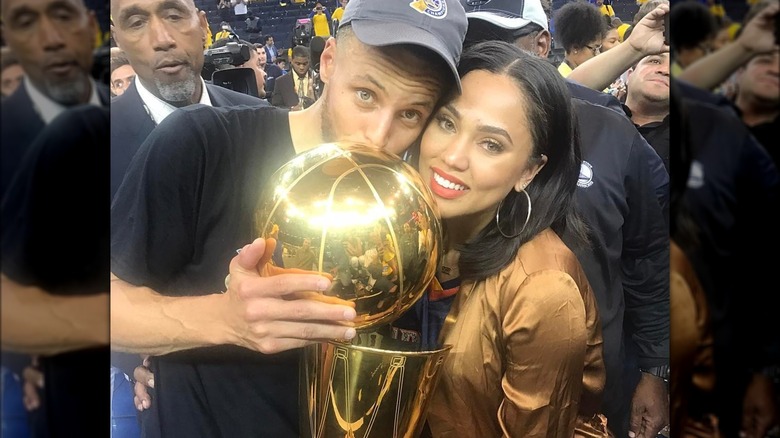 Steph and Ayesha Curry with trophy