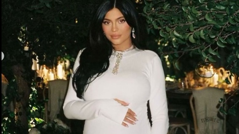 Kylie Jenner holding her baby bump