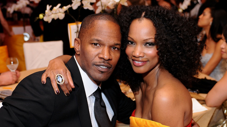 Garcelle Beauvais and Jamie Foxx smiling