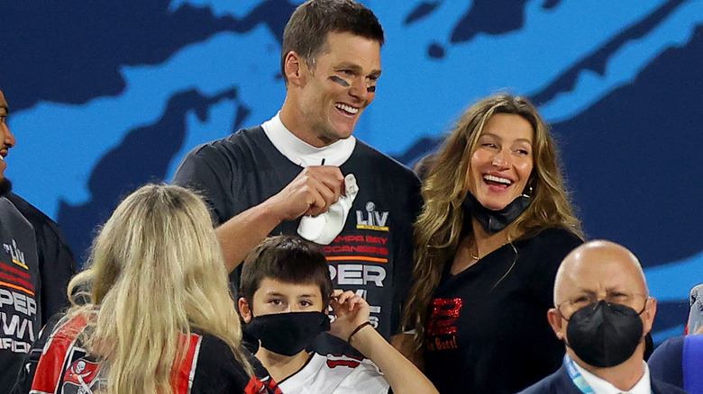 Gisele Bündchen with Tom Brady and one of their kids