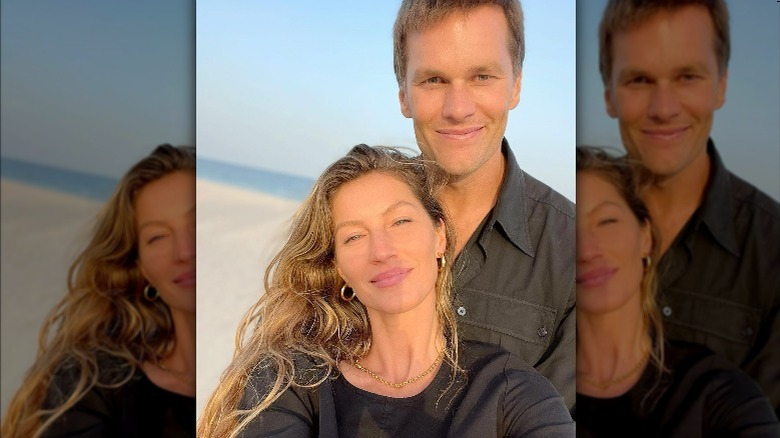 Gisele Bundchen posing with Tom Brady