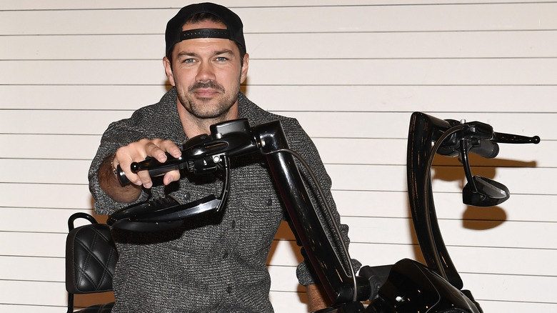 Ryan Paevey on a motorcycle