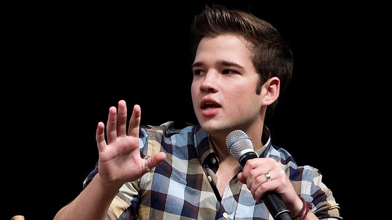 Nathan Kress talking into microphone