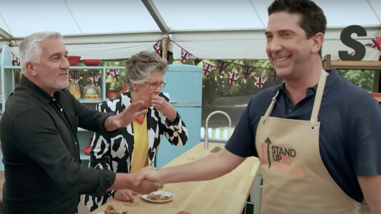 Paul Hollywood shaking David Schwimmer's hand